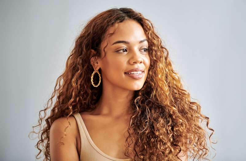 woman with long curly brown hair