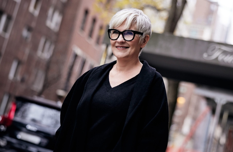 woman standing outside in a city