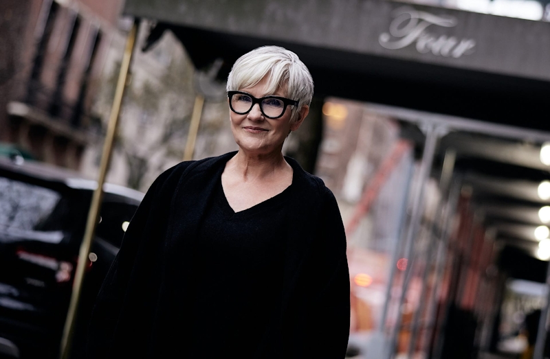 woman walking down a sidewalk
