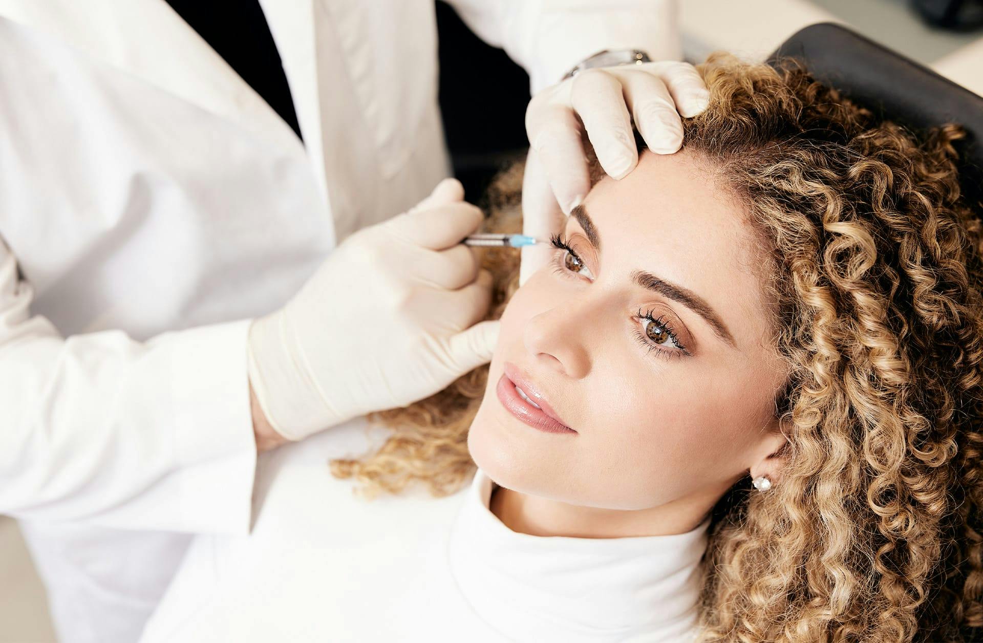 woman receiving facial filler