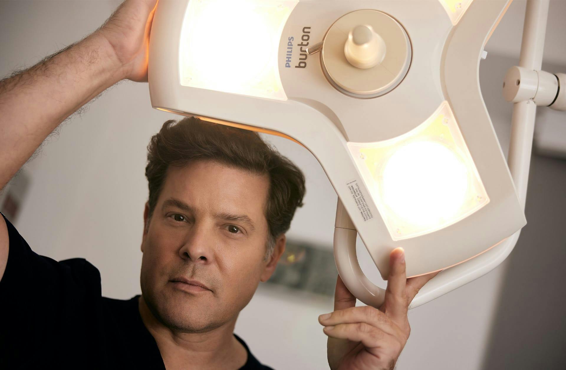 doctor shining a light at the camera