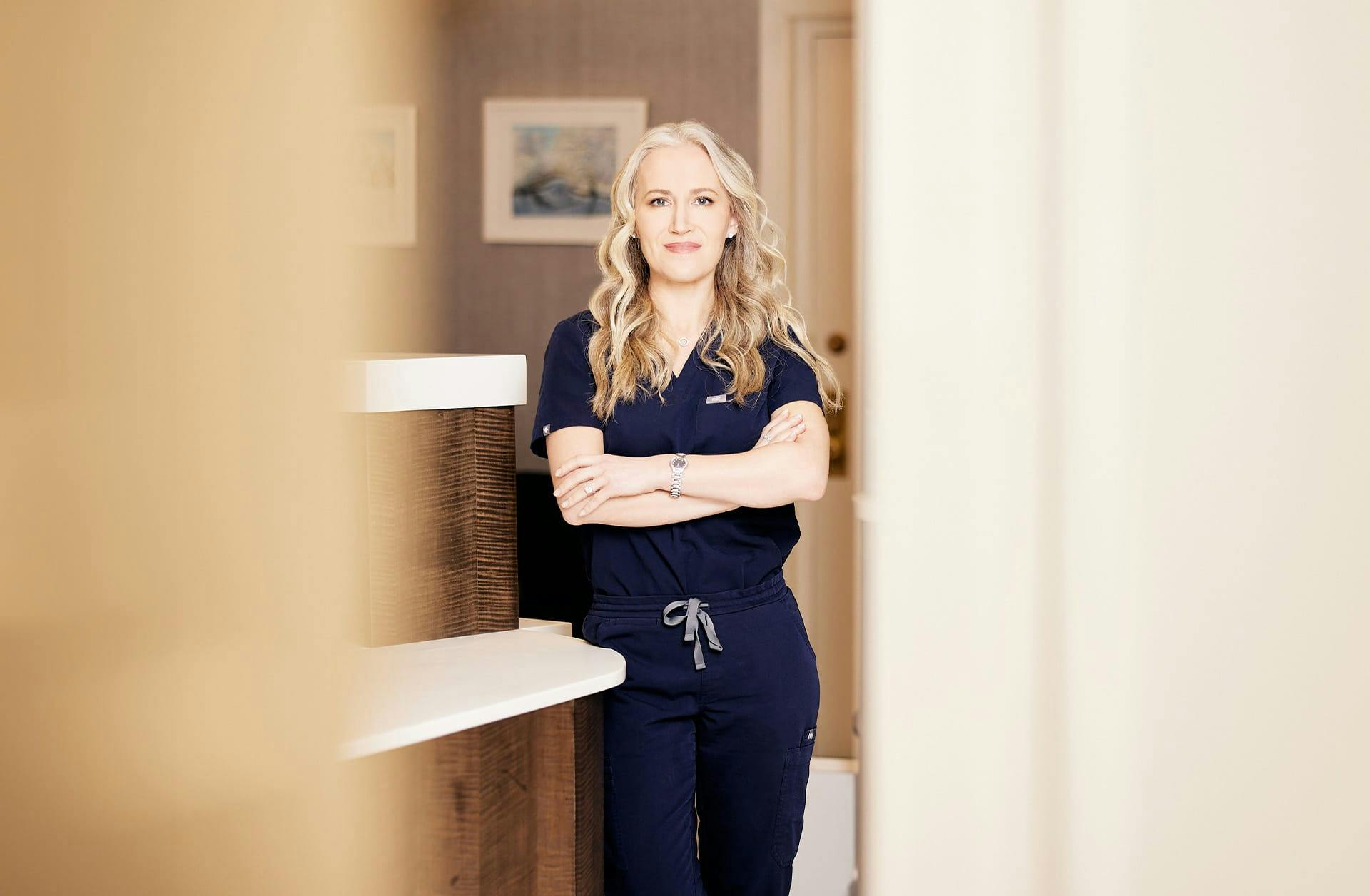 provider standing with her arms crossed