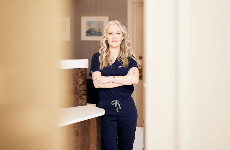 provider standing with her arms crossed