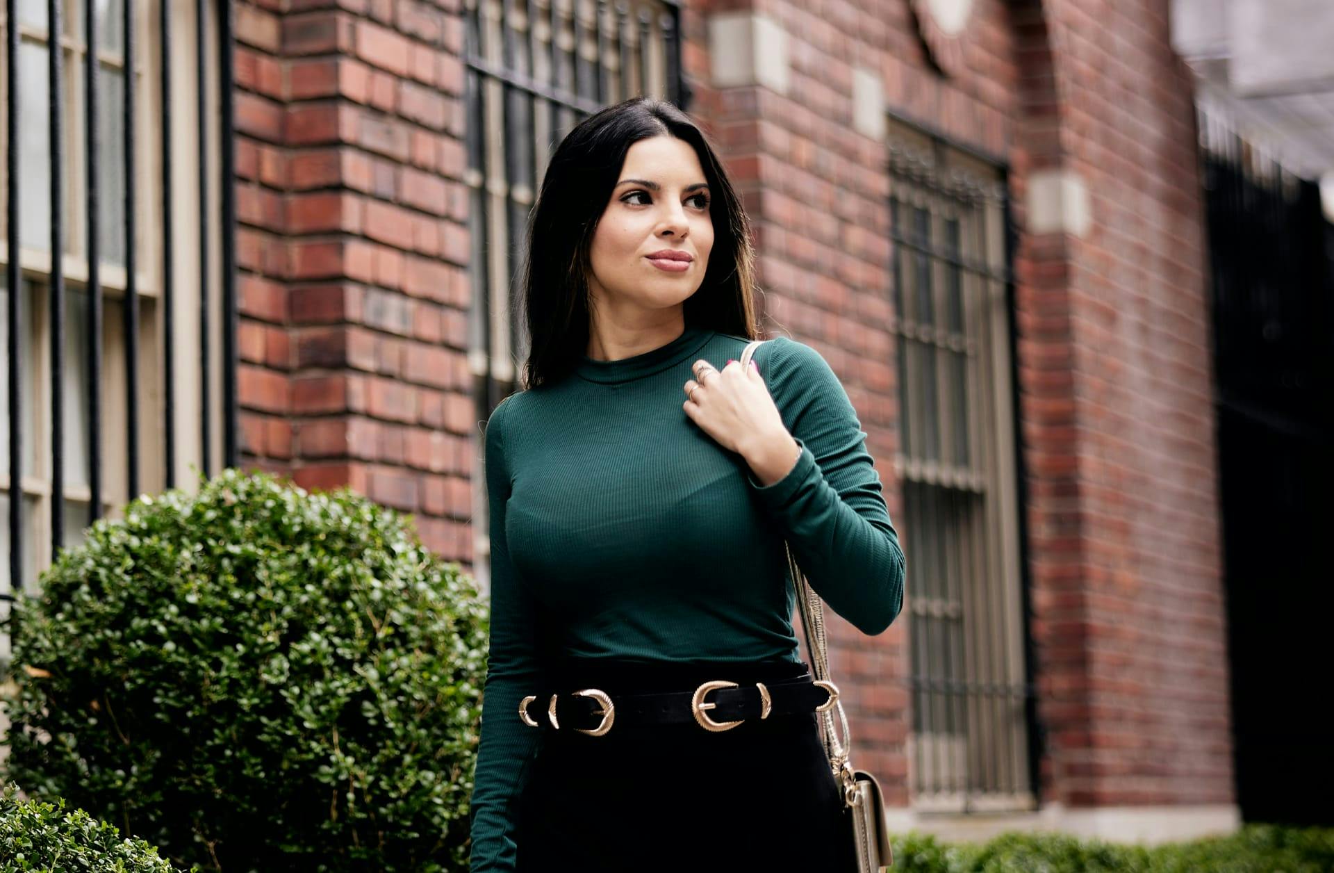 woman in a long sleeve green top