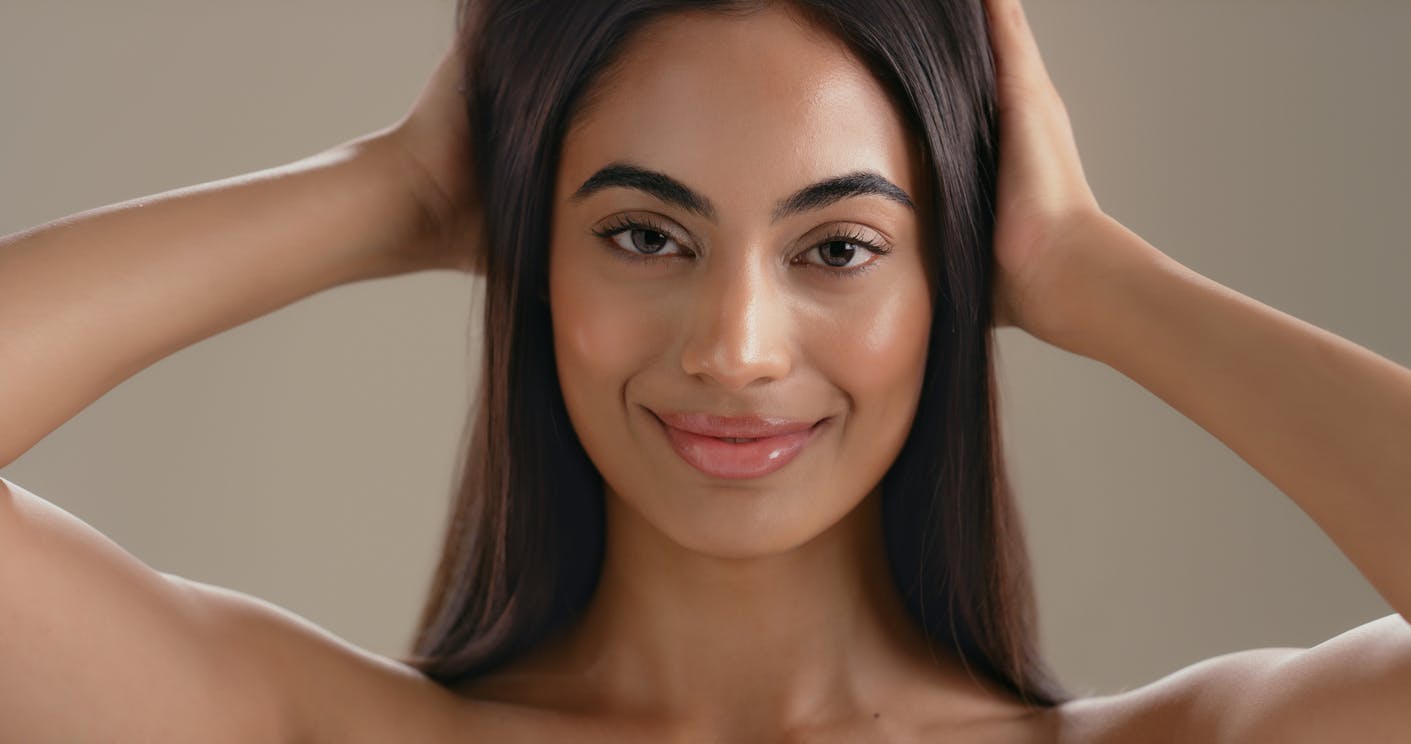 Woman with radiant, refined skin tone and texture