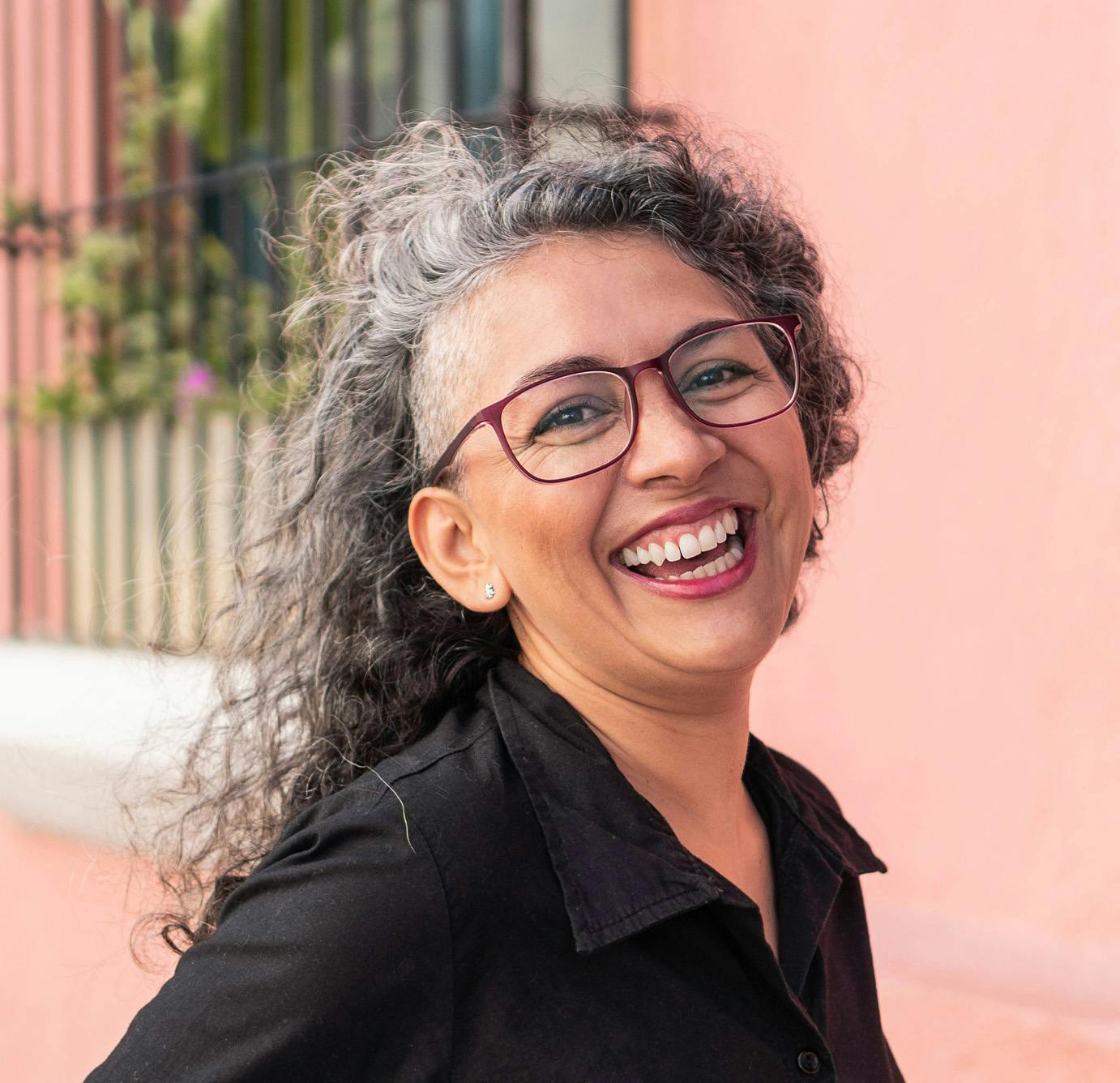 lady in glasses smiling