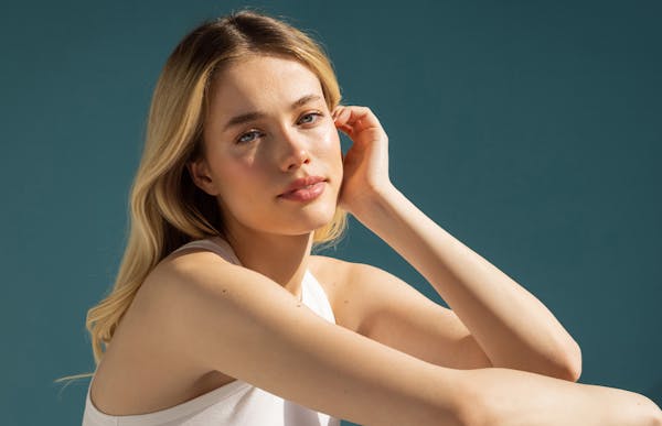 lady putting hair behind her ear