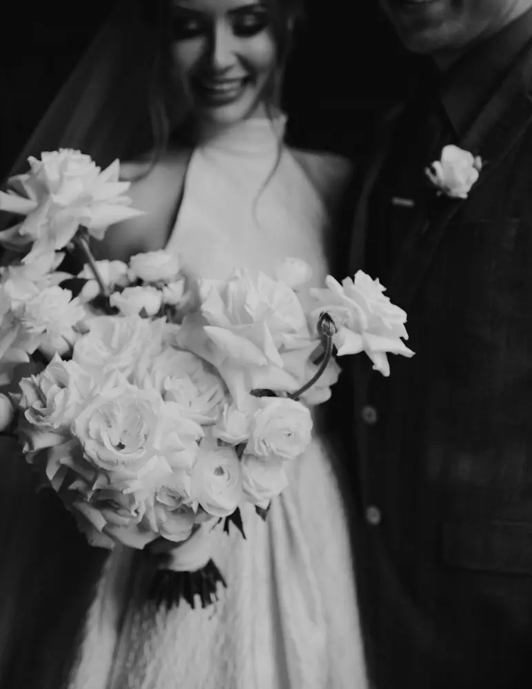 Couple with wedding flowers