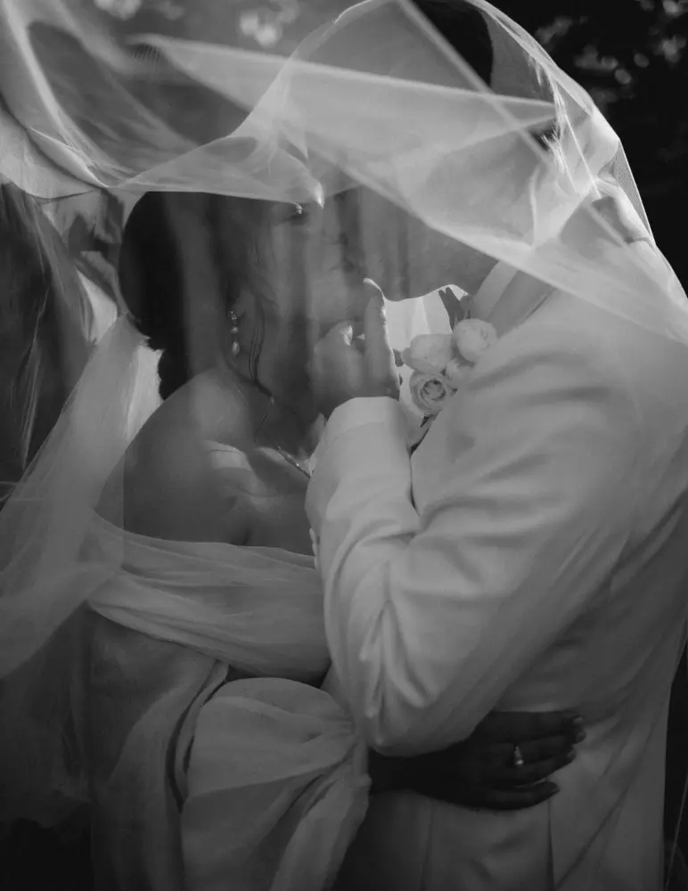 Couple kiss under veil
