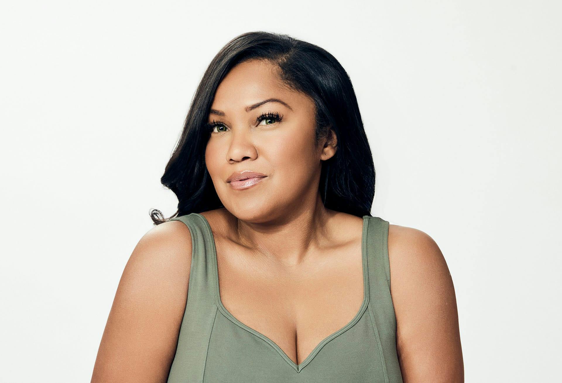 dark-skinned woman in green tank top