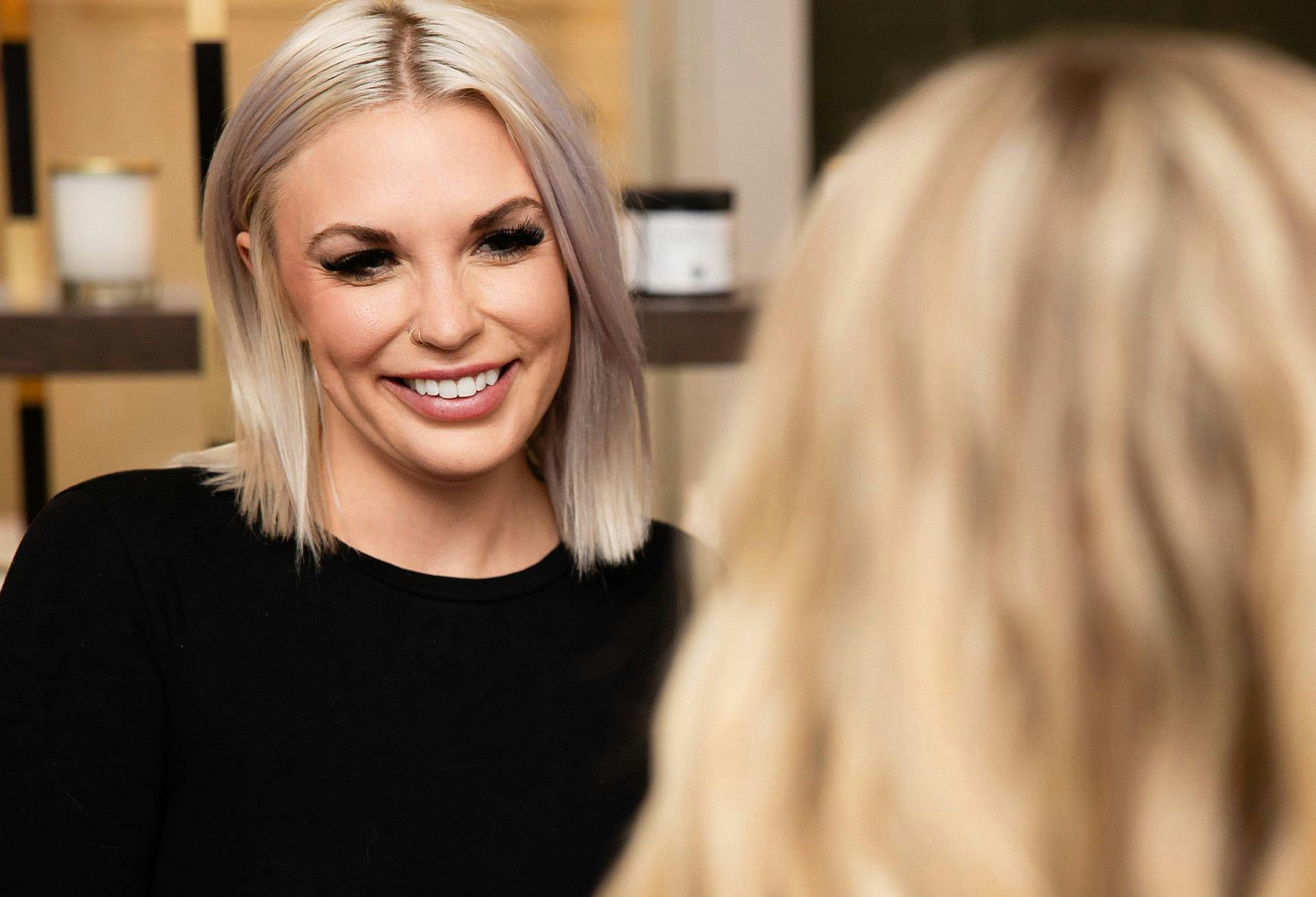 lady smiling at another woman