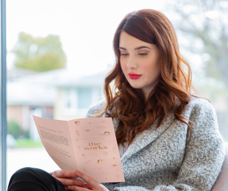 woman reading a brochure