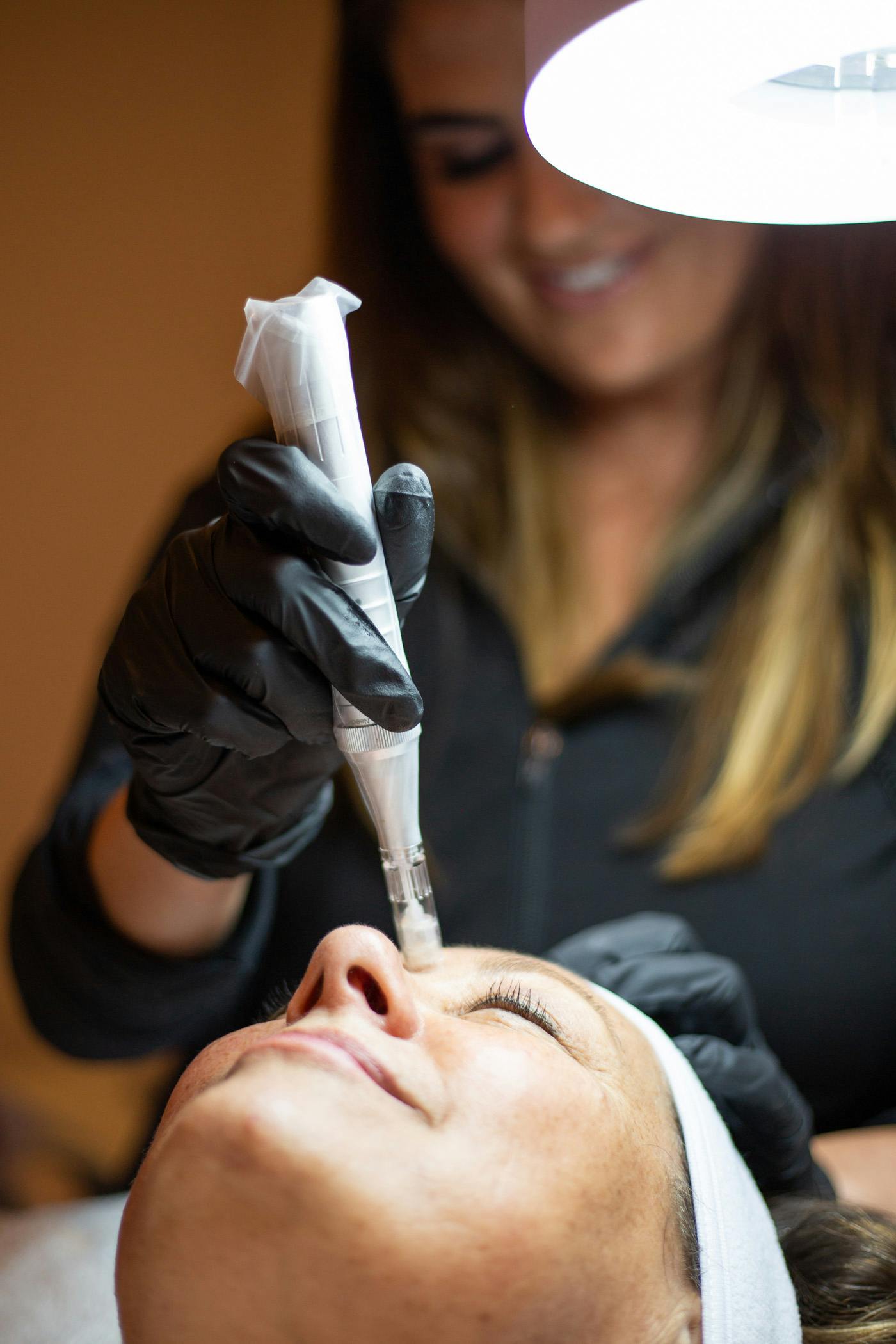 woman getting a facial procedure