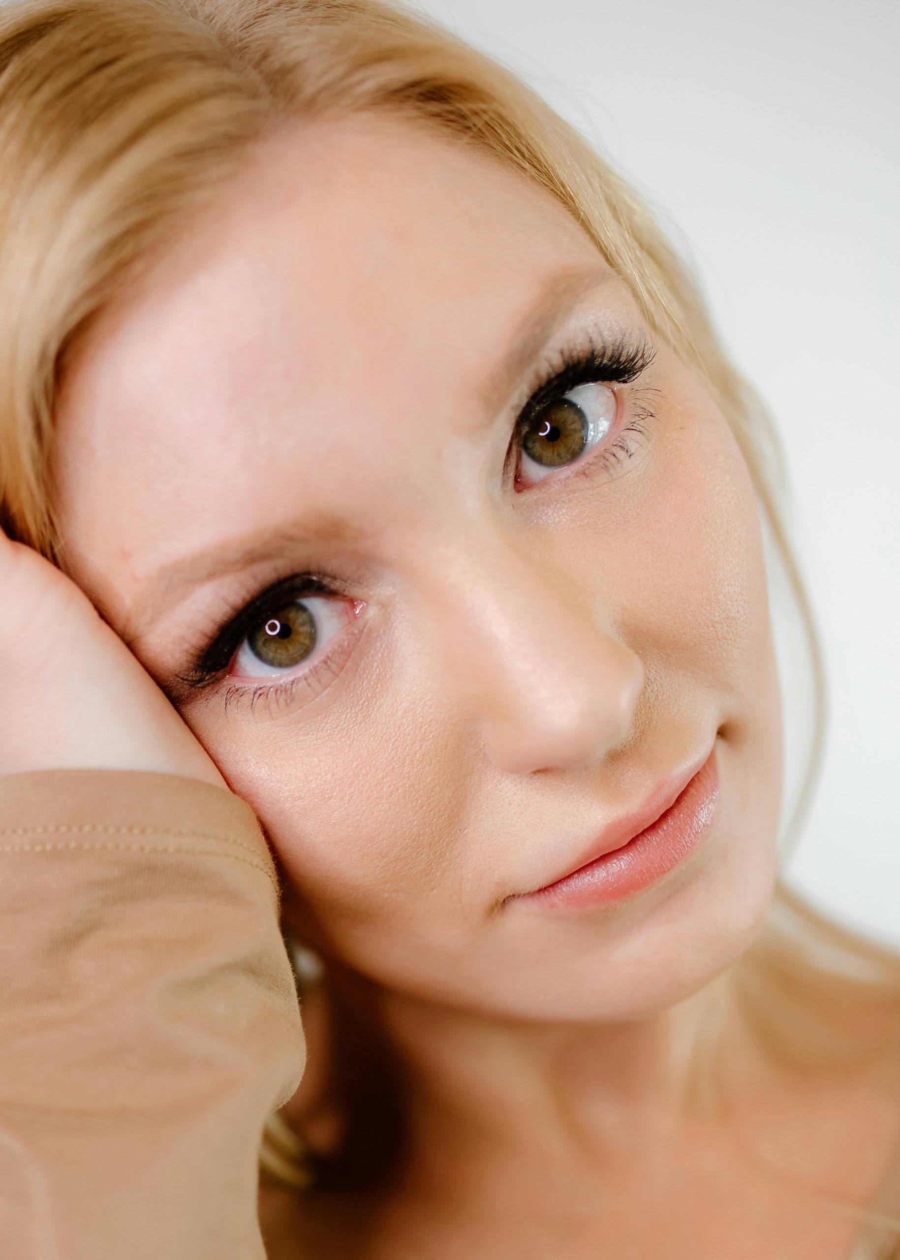 woman with blonde hair and brown eyes