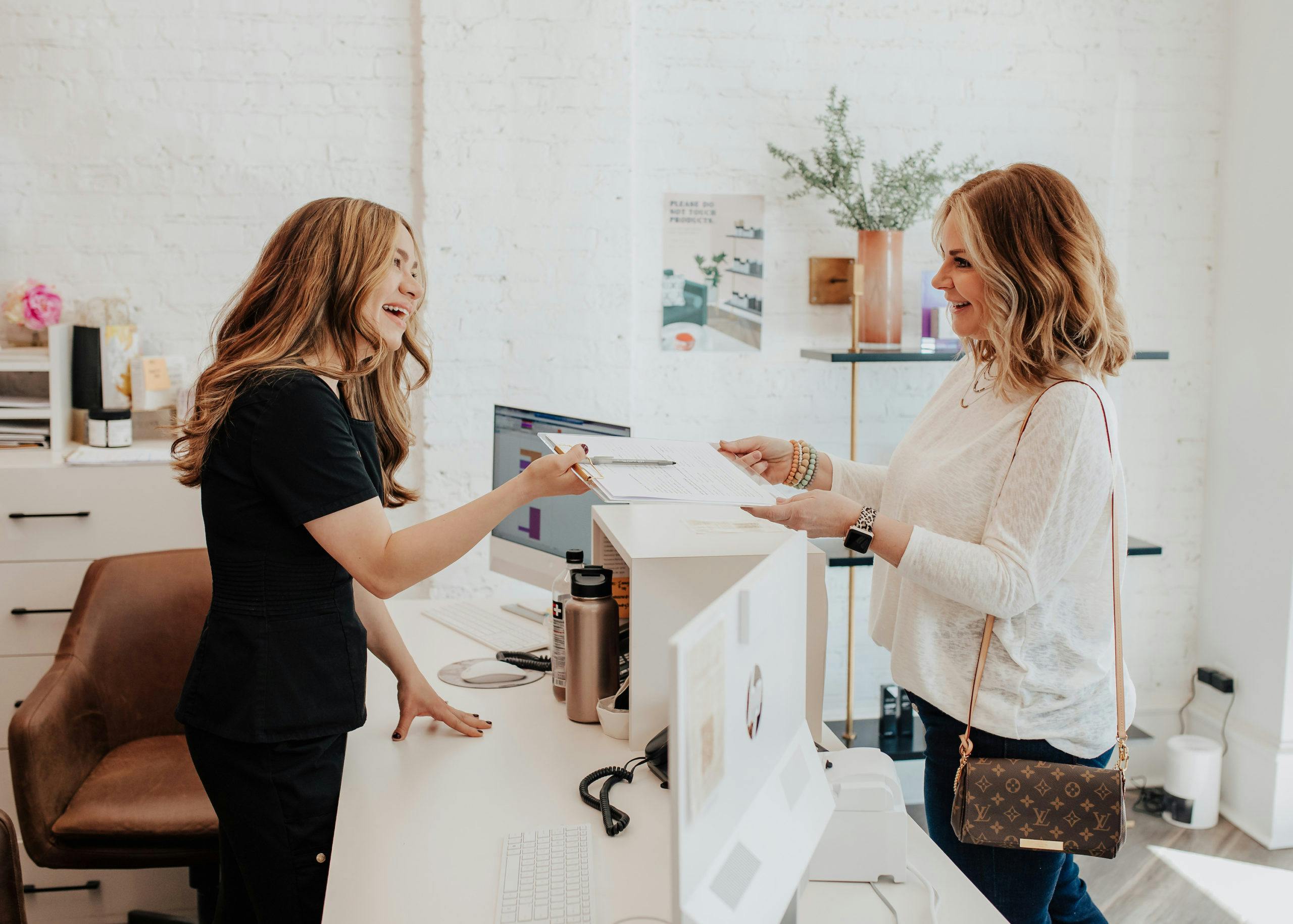 woman filling out paperwork
