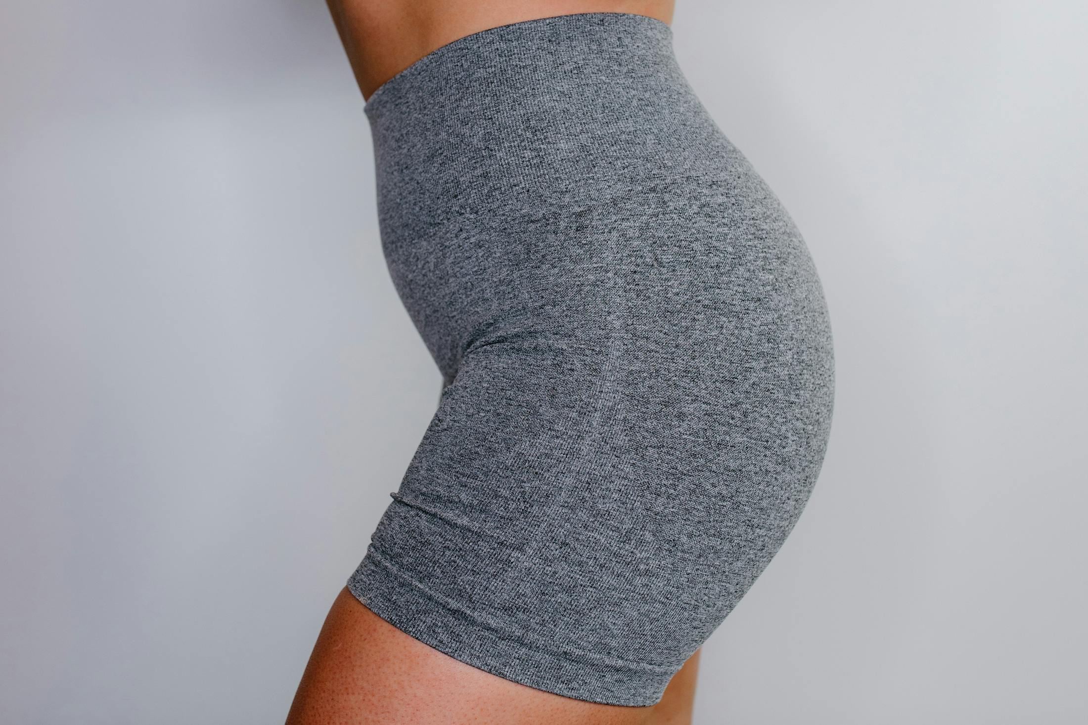 woman wearing grey workout shorts