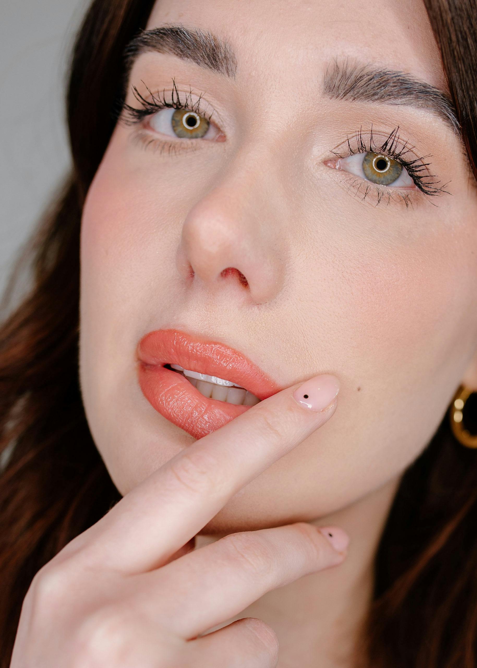 woman wearing coral lipstick