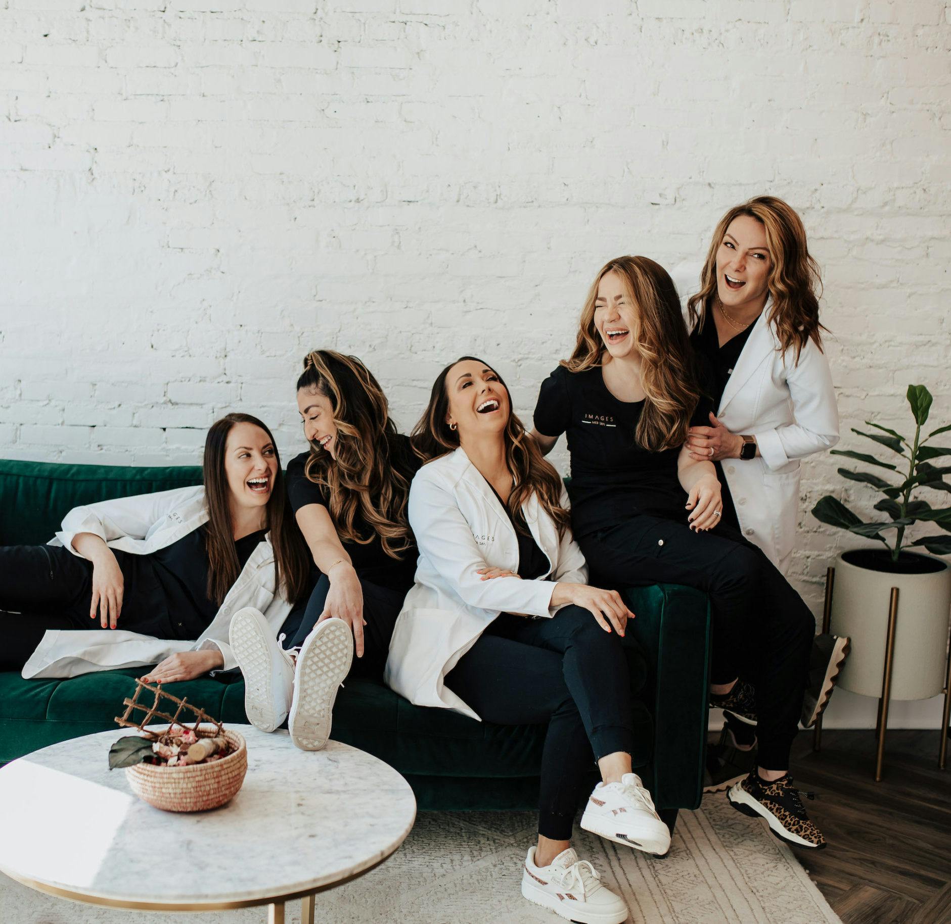 group of women sitting and laughing together