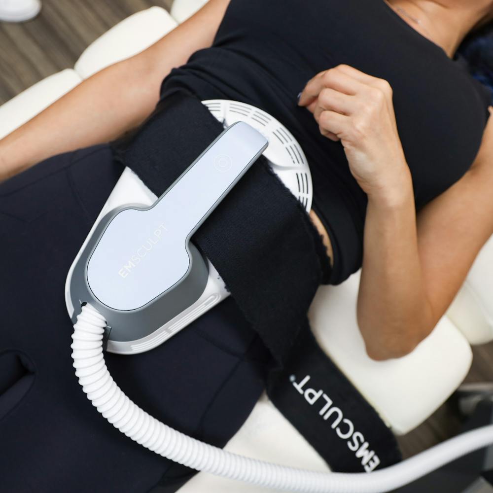 person getting emsculpt treatment