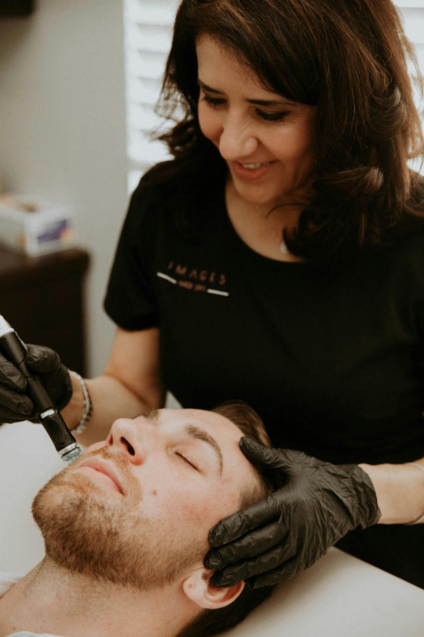 man getting a facial treatment