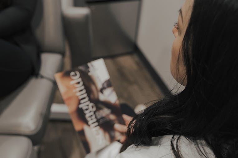 woman reading a magazine