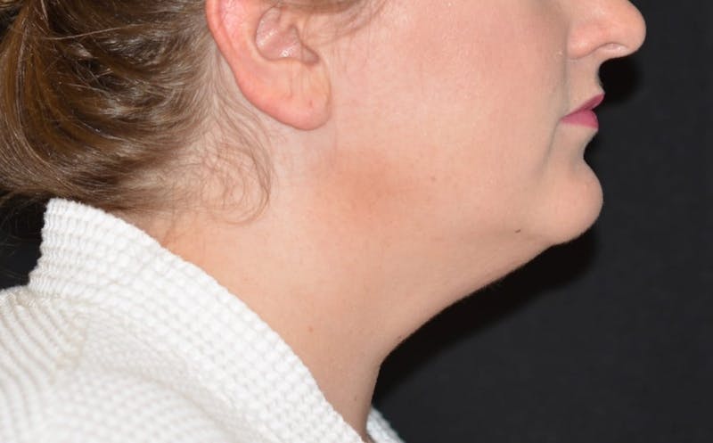 there is a woman with a white robe and a black background