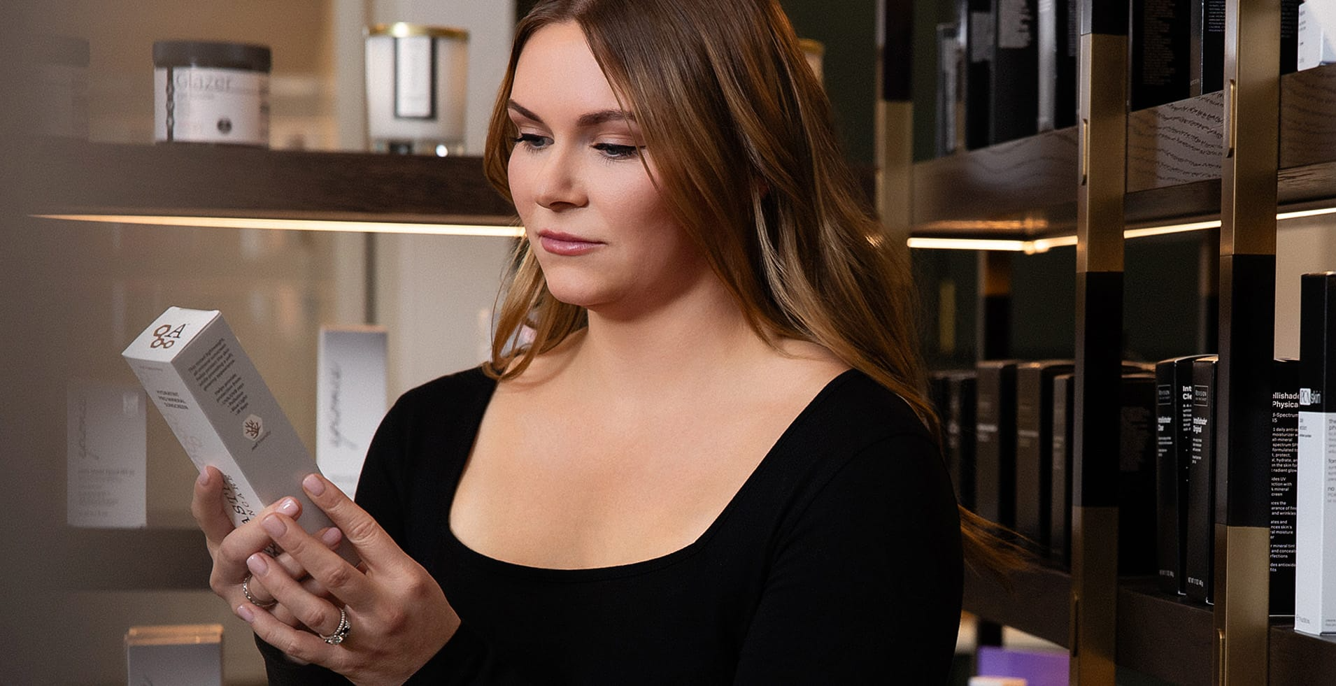 Woman Looking at a Skin Product