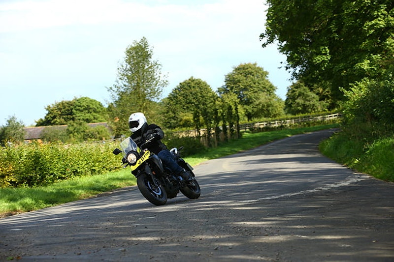 Suzuki V-Strom 250 ridden down a country lane