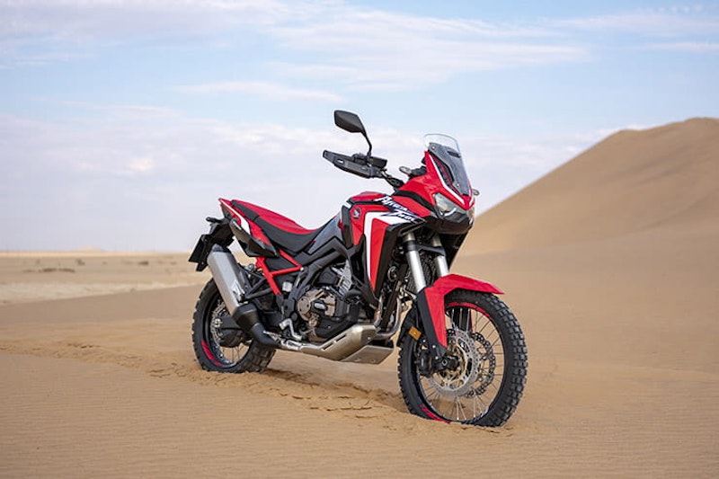 The three new 2020 ‘mid-range’ adventure bikes from Honda, Triumph and Suzuki go head-to-head, on and off-road. We also look at their rivals.
