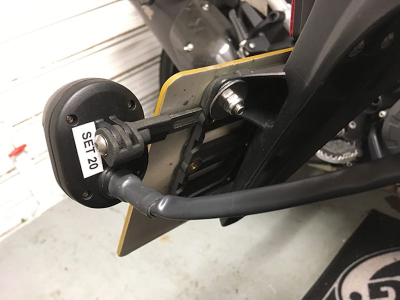The Zona rear view camera mounted on the number plate of a motorcycle