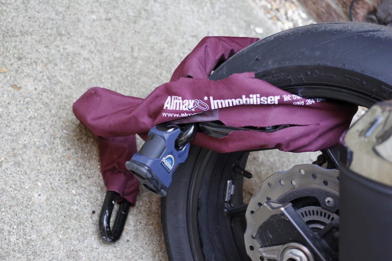A Motorcycle Chain wrapper around a motorcycle wheel