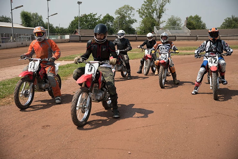 The group take to the track together to ride flat track