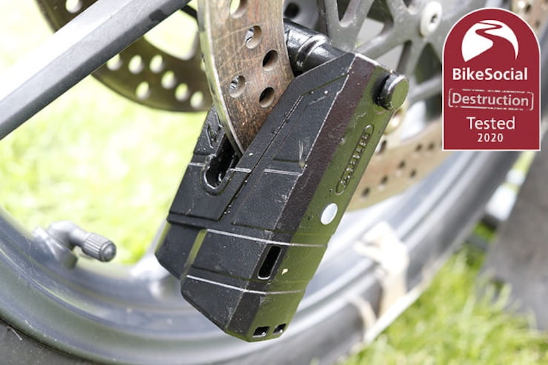 Full destruction review of the alarmed Abus Granit Detecto XPlus 8077 motorcycle disc lock. Cut, smashed and pried to find out if it will protect your bike