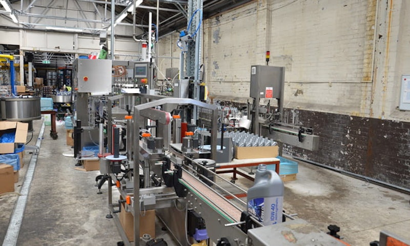 containers of Rock Oil are filled on the production line