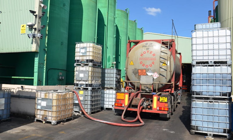 Oil is unloaded from a tanker