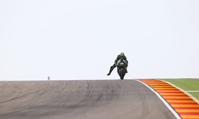 Why do MotoGP riders dangle a leg
