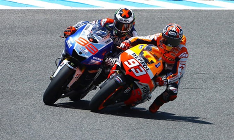 Why do MotoGP riders dangle a leg