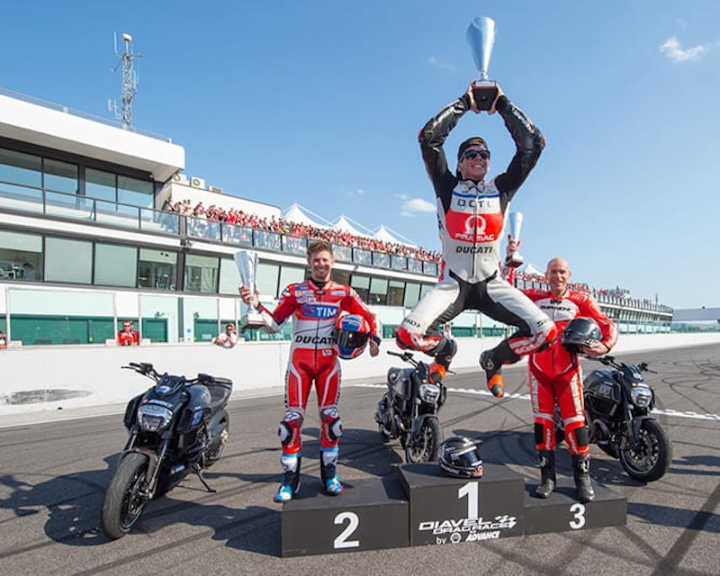 Redding shows how pleased he is while Stoner looks on.