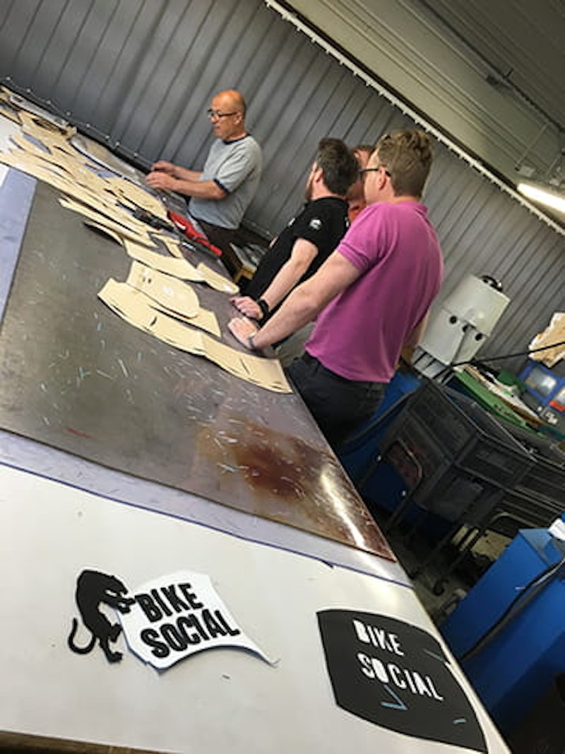 Elise with his Sam Lowes-shaped cardboard and leather jigsaw