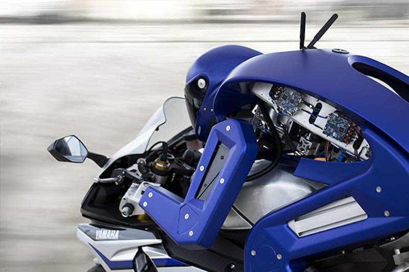 Head down, on it. That is a robot riding an R1. God help us.