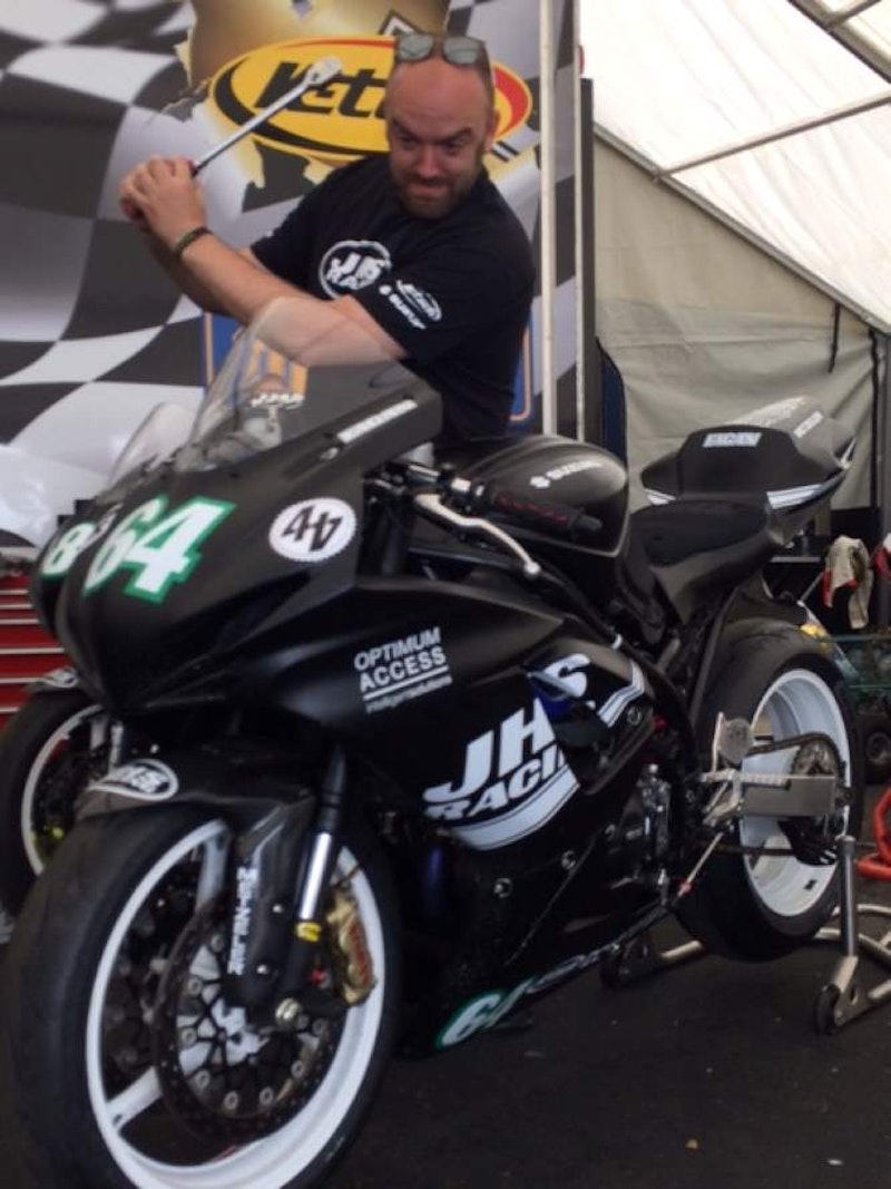 TT newcomer, Al Fagan, makes some minor last minute adjustments