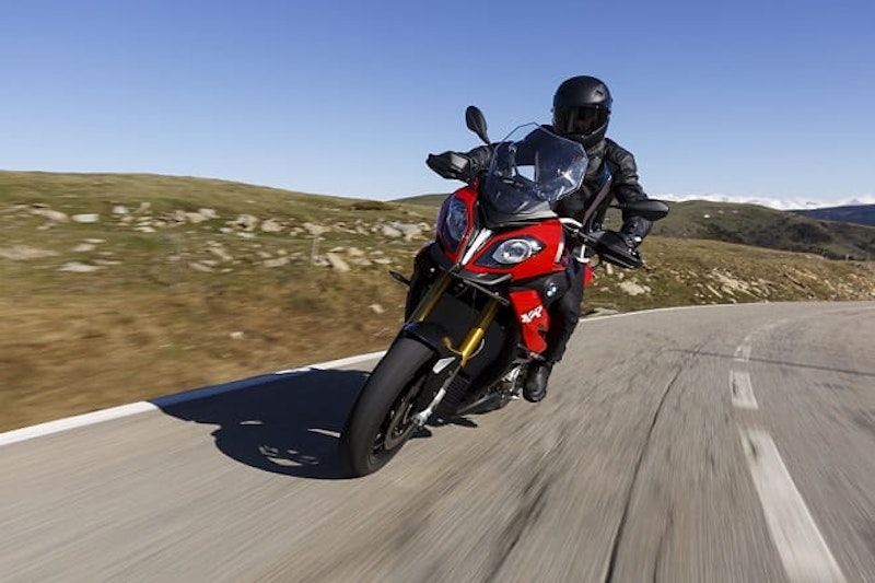 Great roads, blue skys and the thrum of a big 1000cc motorcycle underneath. Adventure? Oh go on then, even if it is in a sports adventure package.