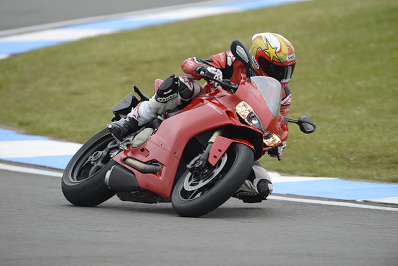 Using all of the 1299s electronics to pin the throttle on the exit of the final hairpin