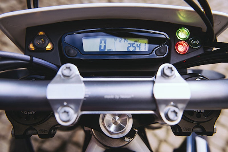 The slim instrument panel holds minimal information