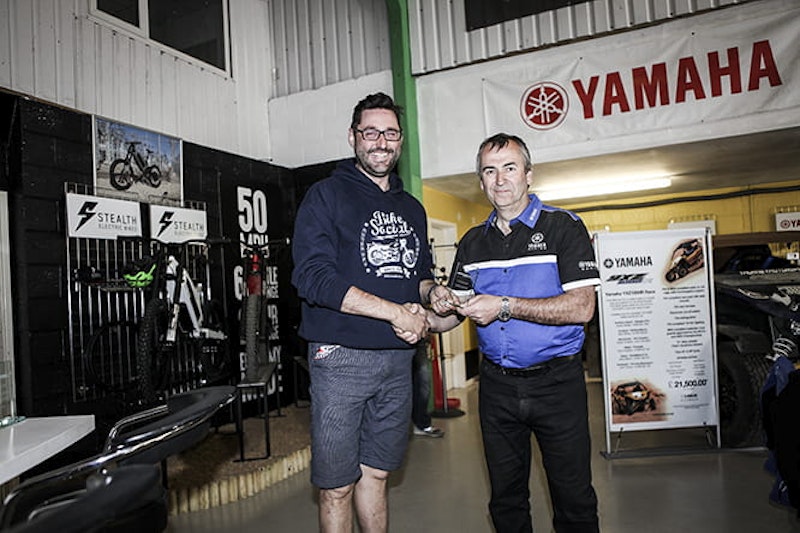 Bike Social's Potter takes the third place trophy from Yamaha's Jeff Turner, they're smiling now, but the crash bill hasn't been put in the post yet.