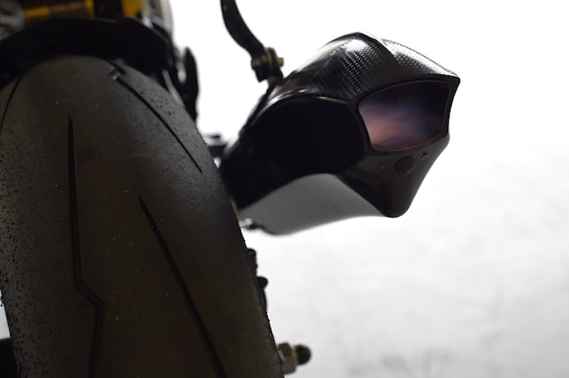 Akrapovic exhaust spits flames MotoGP-style.