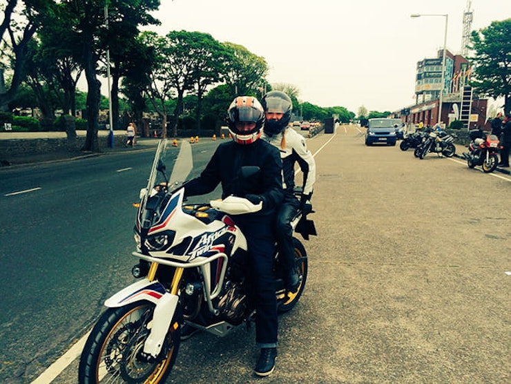 Mr and Mrs Mann the Africa Twin for a lap of the TT course