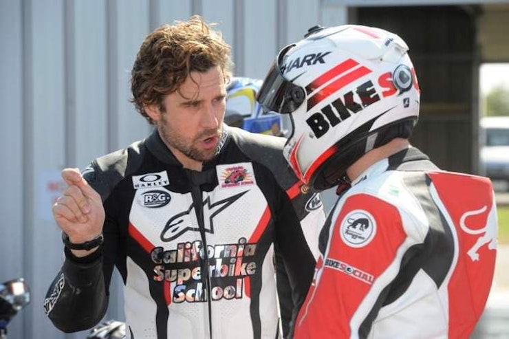 Instructor Chewie demonstrated the gesture he'll use on track for throttle control