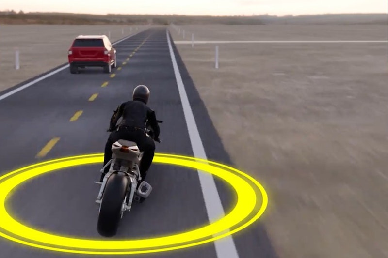 A CGI motorcycle begins to overtake a car