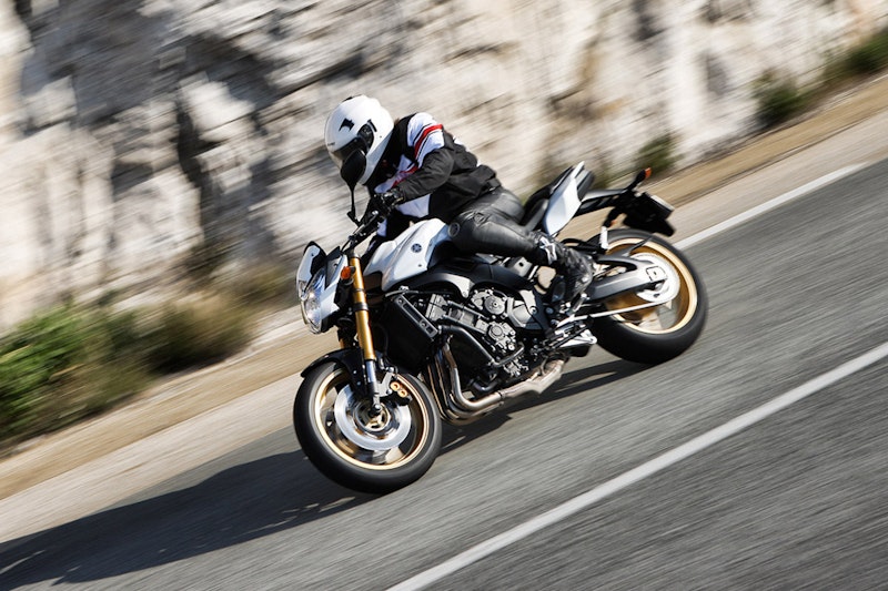 2010 Yamaha FZ8 white colour slight right hand curve mountainous background